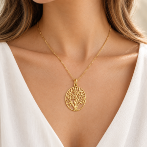 Woman wearing the Aurelia Tree of Life gold-plated 925 sterling silver pendant on a fine chain