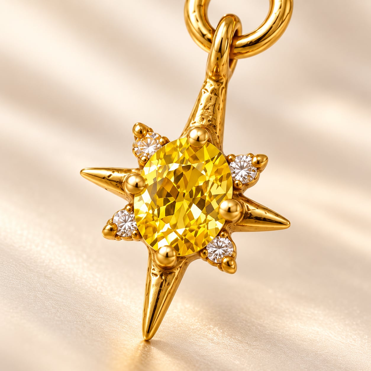 Close-up of Solara starburst pendant showing faceted golden-yellow oval stone and clear accents