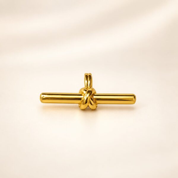 Aurelia Knot Bar Pendant in polished gold tone with sculptural centre knot, front view