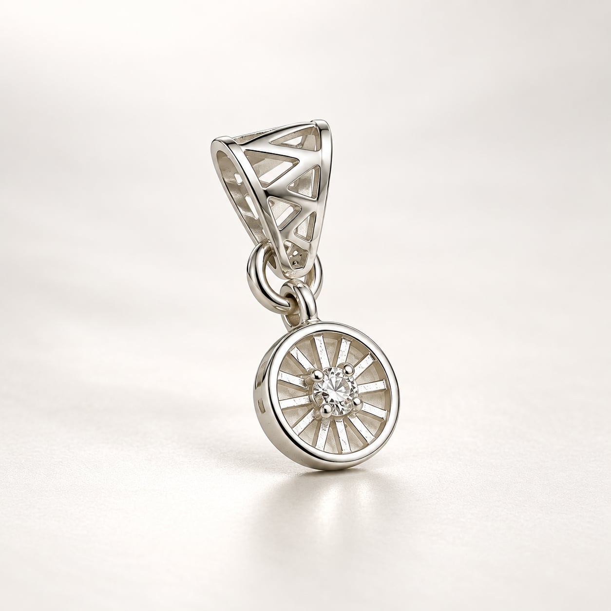 Angled view of Meridian Halo silver-tone geometric pendant with round clear stone and openwork bail