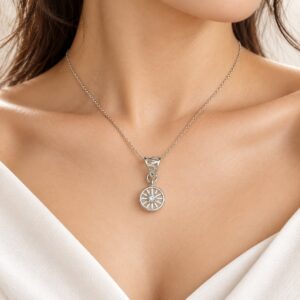 Woman wearing Meridian Halo silver-tone pendant with round geometric design and clear centre stone