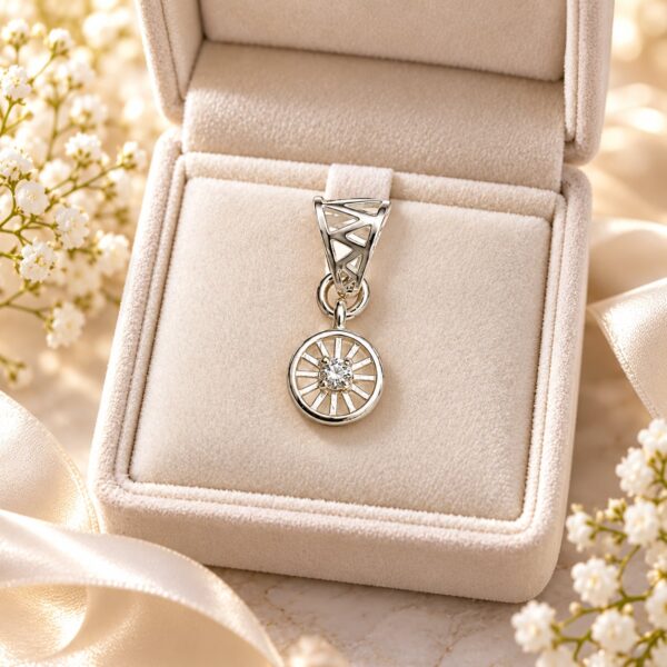 Meridian Halo silver-tone pendant with round clear centre stone displayed in a cream jewellery box