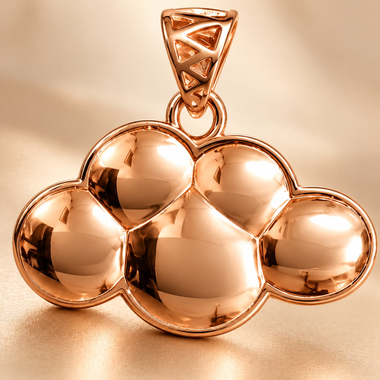 Macro detail of the Cirrus Cloud pendant showing polished rose gold contours and geometric bail