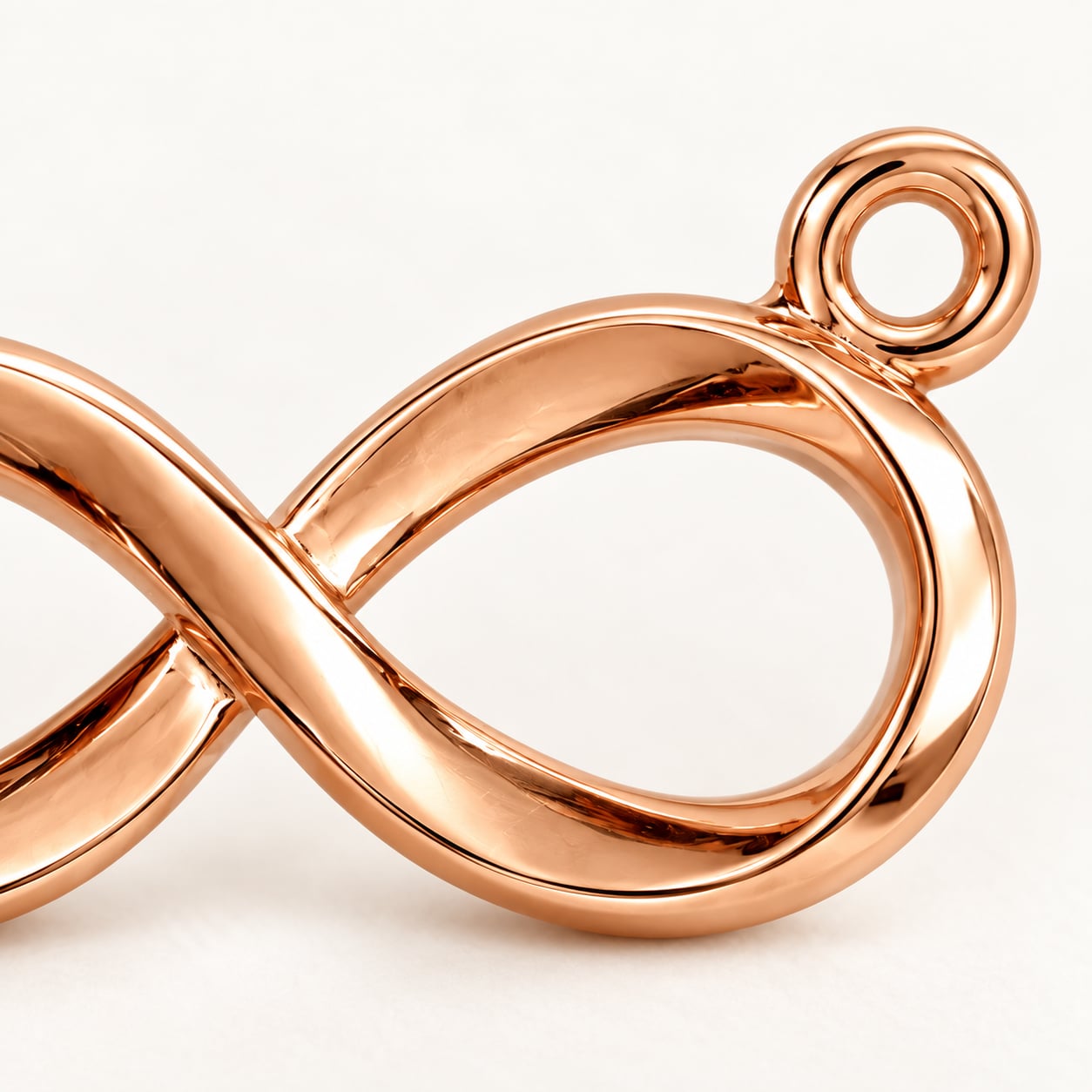 Macro detail of rose gold finish and side loop on a 925 sterling silver infinity pendant