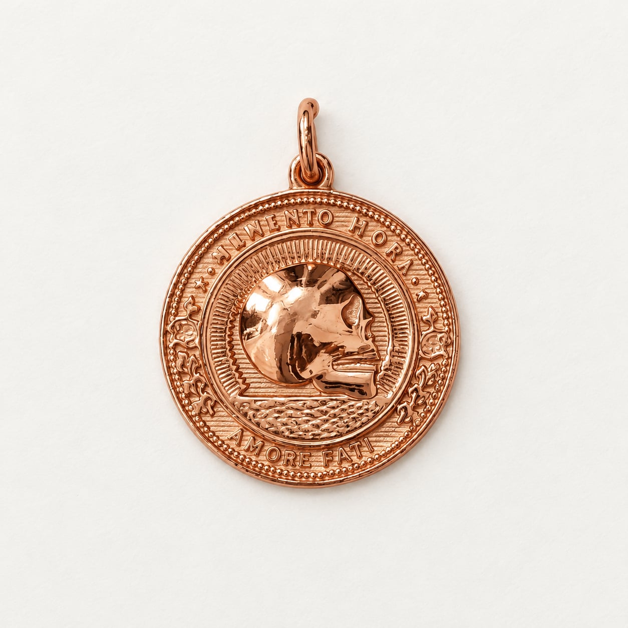 Front view of Amor Fati Memento Hora rose gold medallion pendant on white background